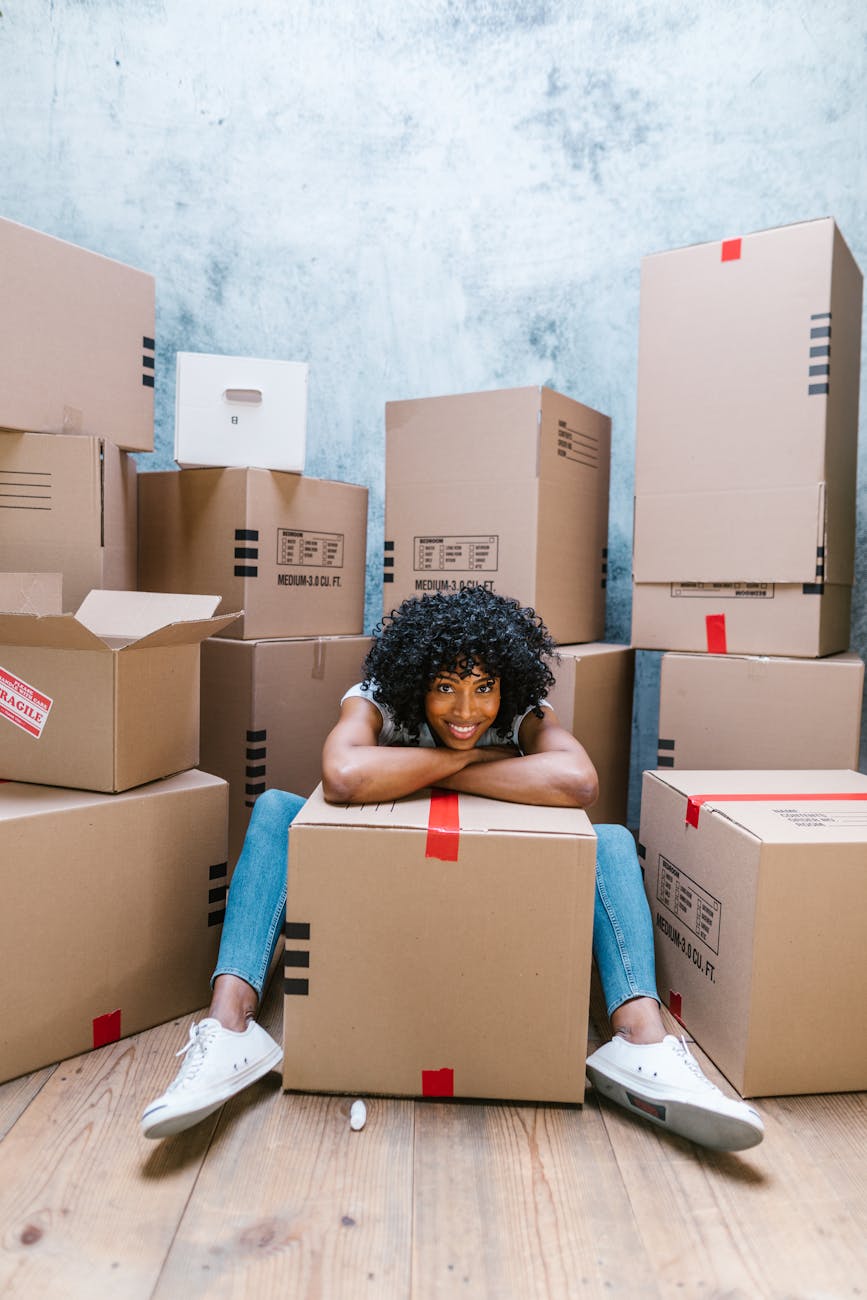 Planning a Career Change: Key Steps for a Smooth Transition 10 woman in blue denim jeans sitting on brown cardboard boxes Planning a Career Change: Key Steps for a Smooth Transition