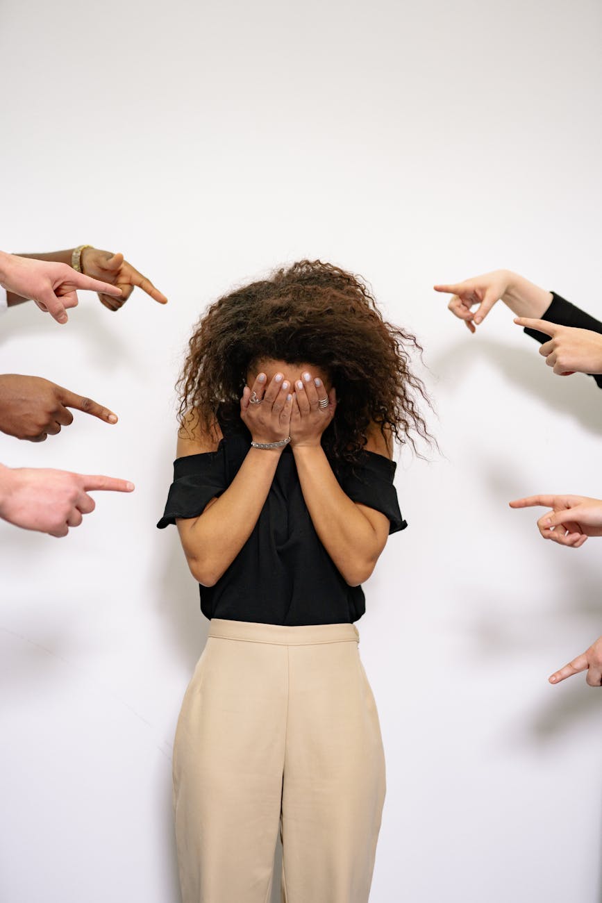people pointing fingers at a stressed woman How to Overcome Business Challenges and Get Back on Track