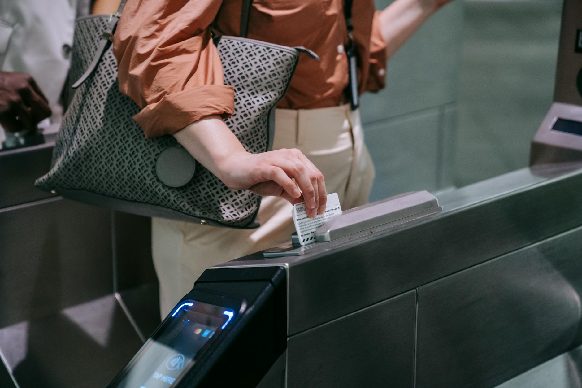 close up of woman sliding the card in a subway terminal How To Take Control Of Your Business & Achieve More Success
