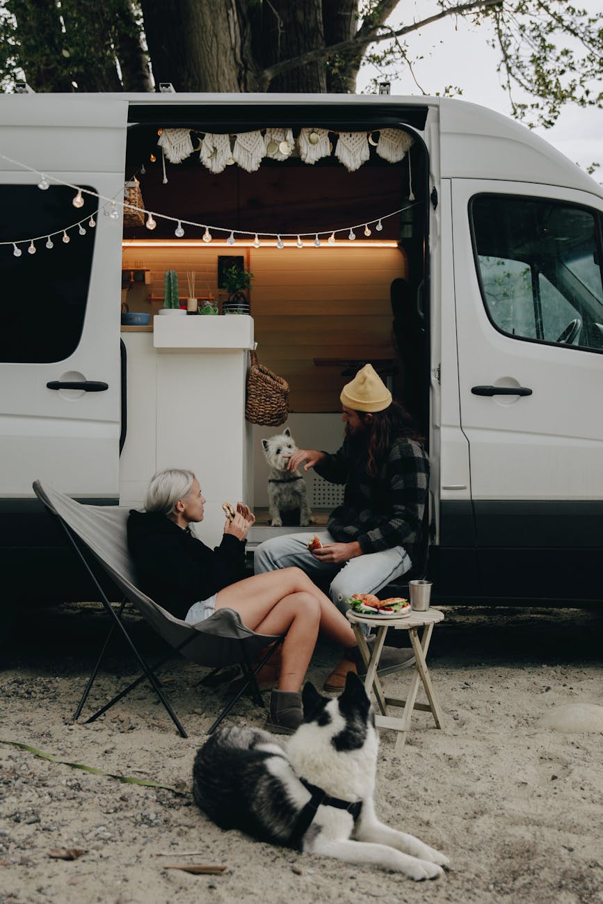 RV Trip Essentials: Plan an Epic Camping Adventure 7 woman in black sweater sitting on folding chair RV Trip Essentials: Plan an Epic Camping Adventure