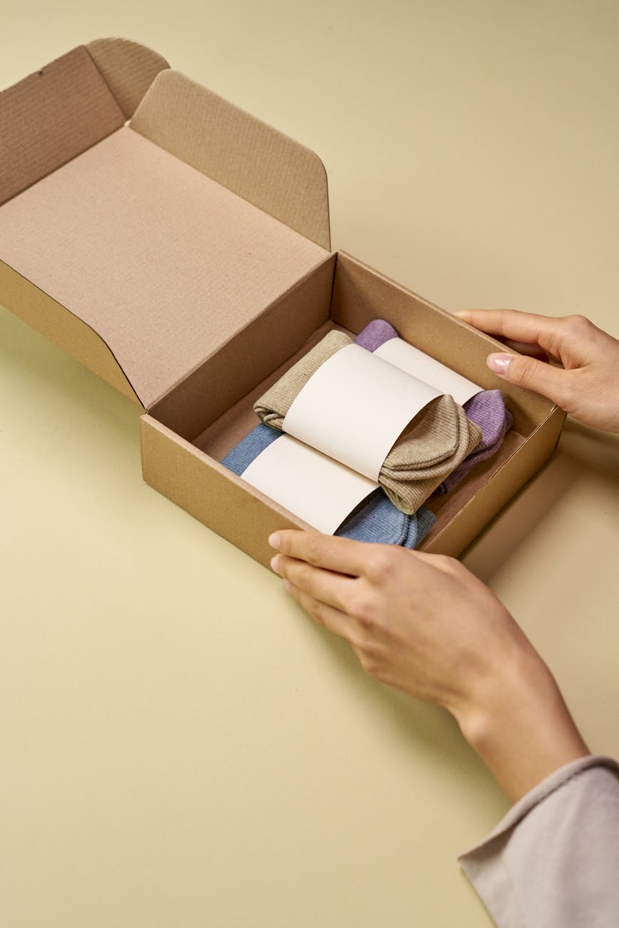 person holding brown cardboard box Why Packaging Design Is Part of Customer Service Levels (And How to Get It Right)