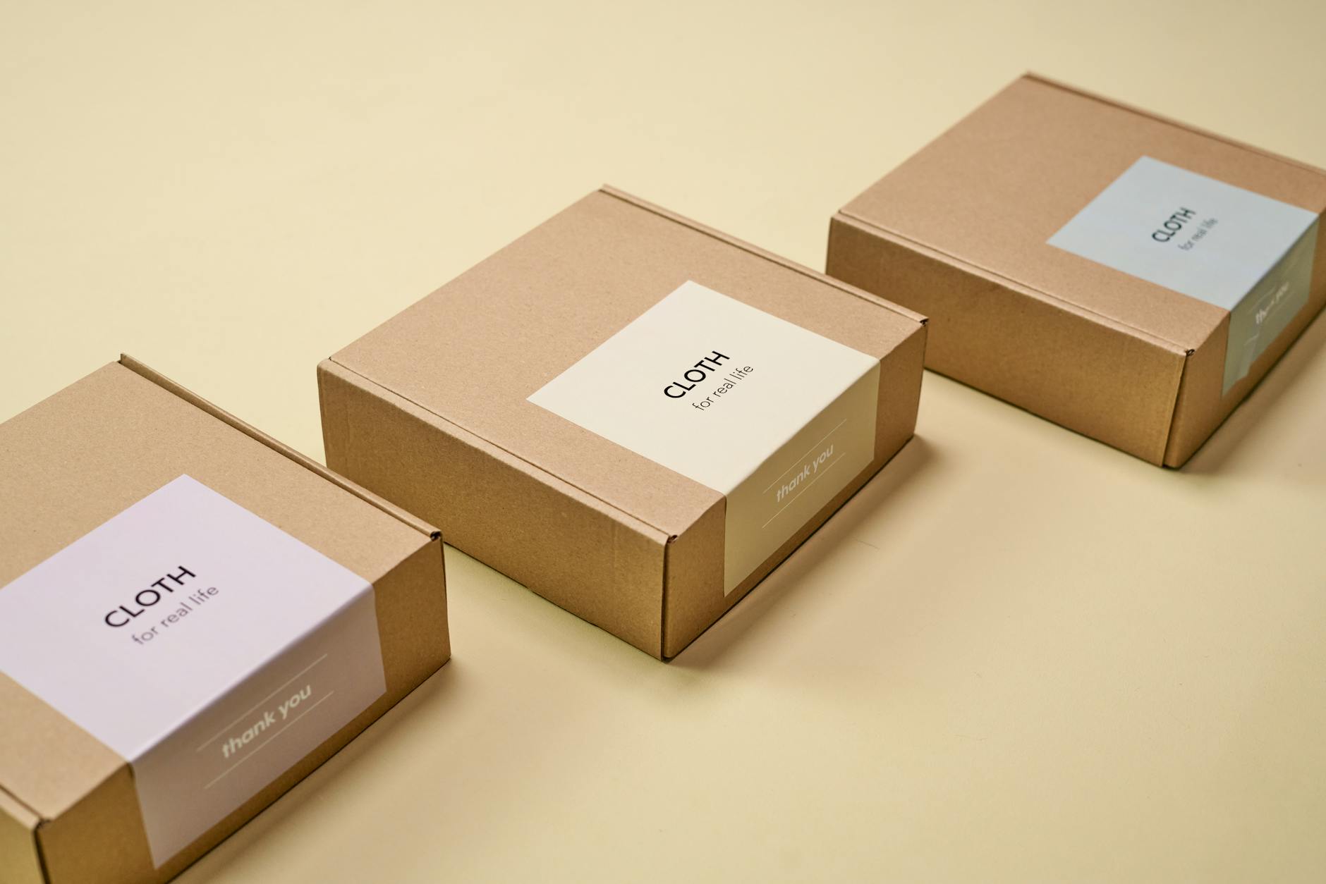 brown cardboard boxes on yellow surface Why Packaging Design Is Part of Customer Service Levels (And How to Get It Right)