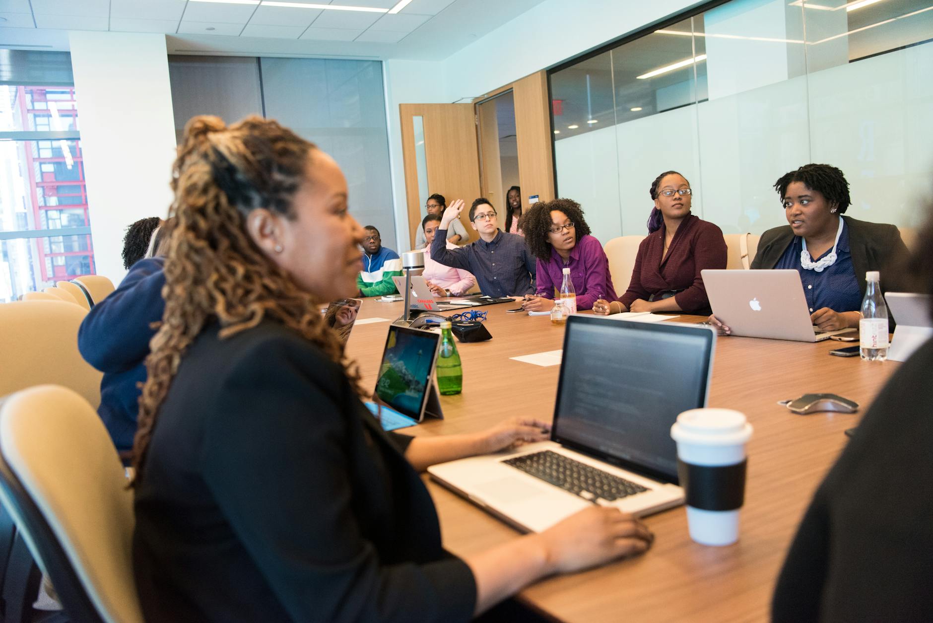 group of people sitting on chair in front of wooden table inside white painted room Employee Online Policy: How to Create Clear Rules Your Team Will Actually Follow