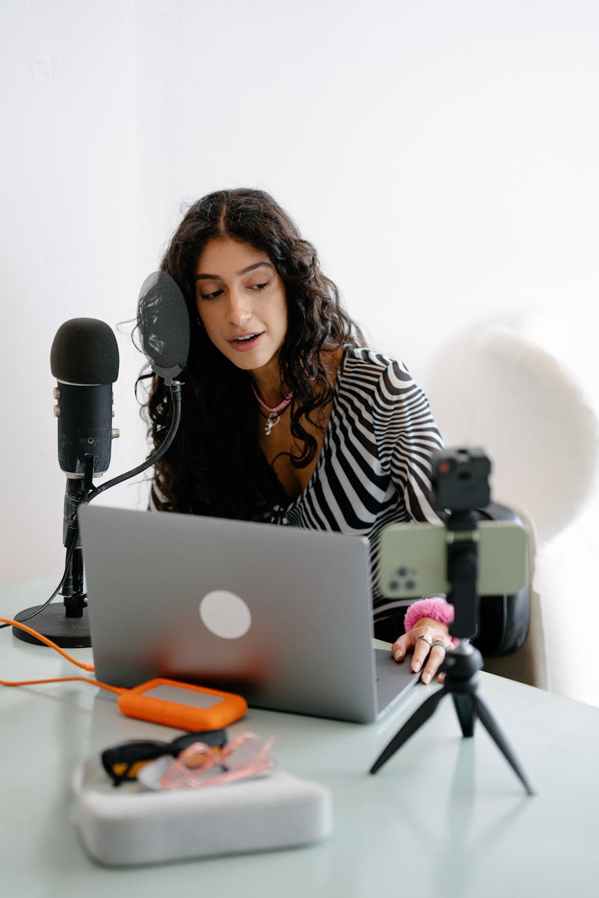 woman recording by desk Employee Online Policy: How to Create Clear Rules Your Team Will Actually Follow