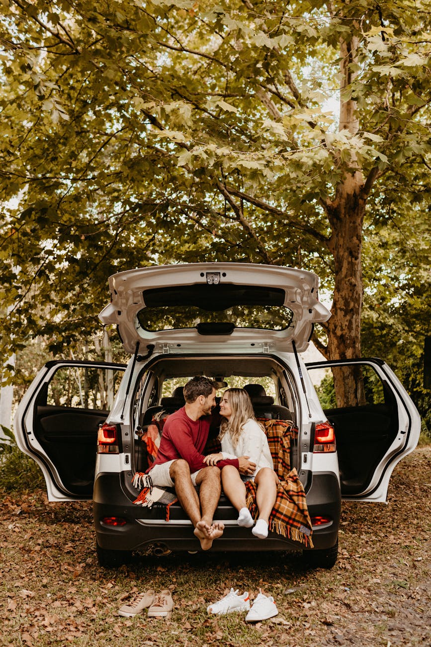 Road Trip Packing: What Every Woman Should Bring for Comfort + Safety 9 photo of couple sitting in the back of car Road Trip Packing: What Every Woman Should Bring for Comfort + Safety