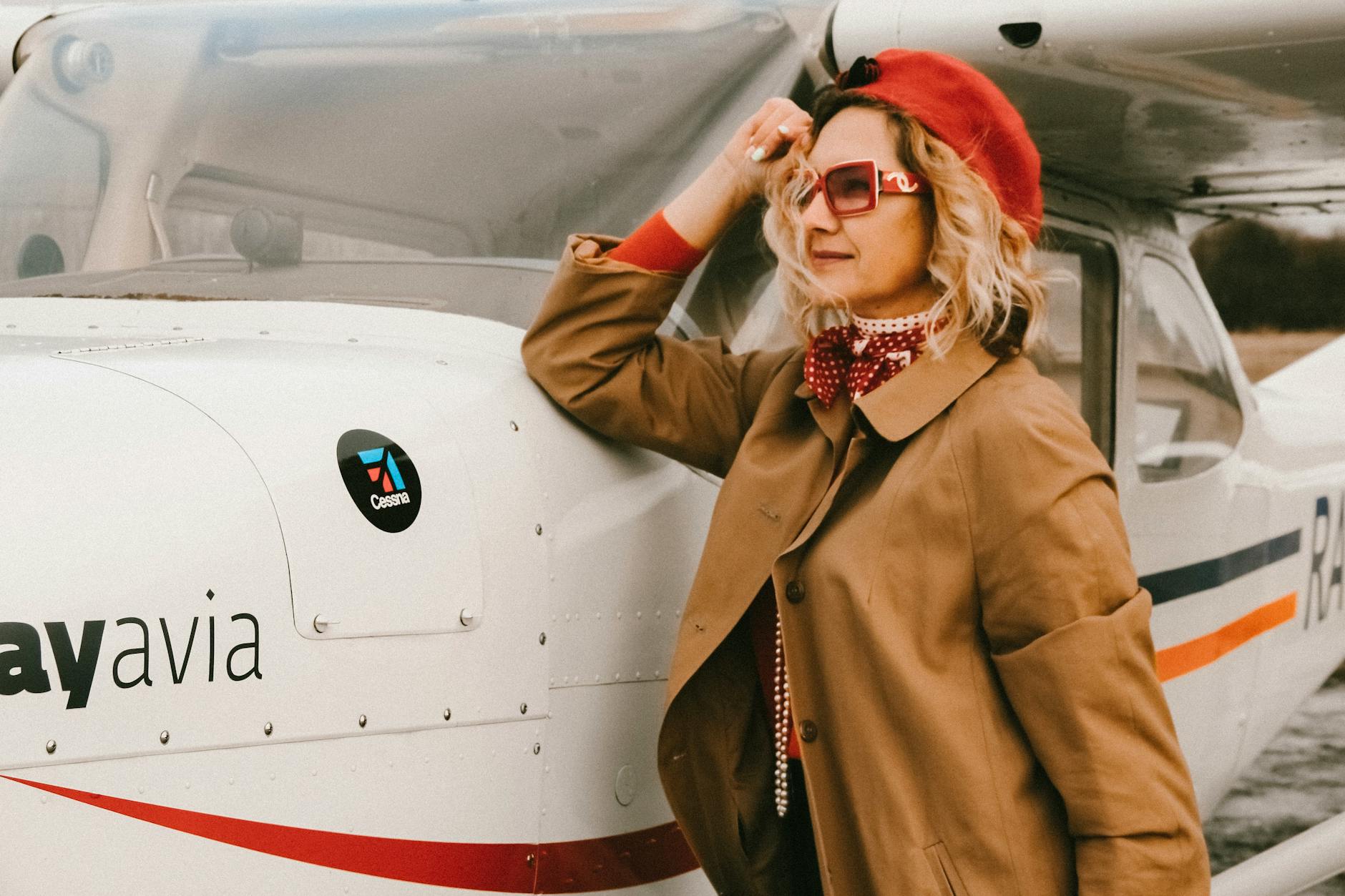 woman standing near airplane