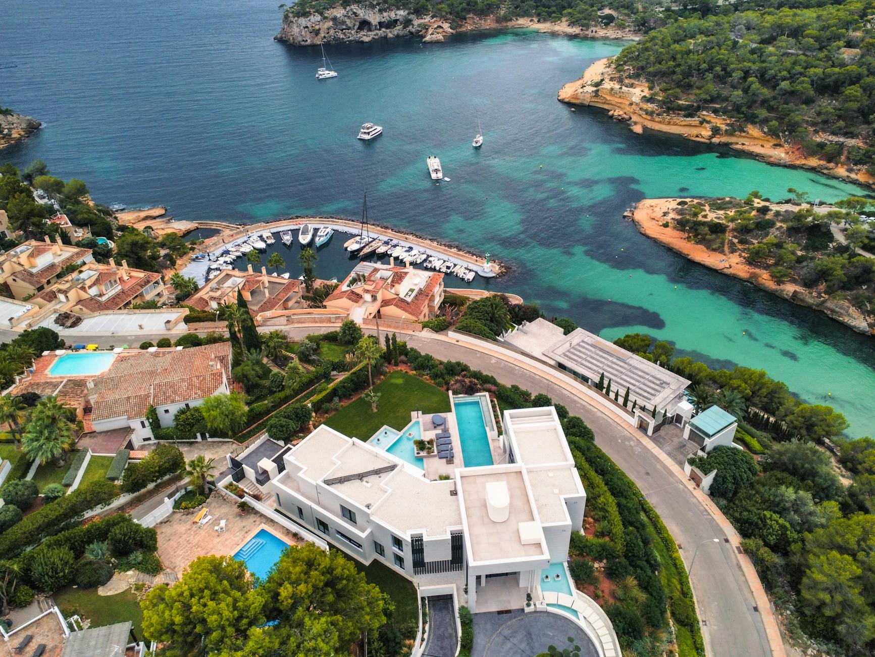 aerial view of luxurious coastline villas and marina Your Ultimate Guide to Buying a Luxury Home