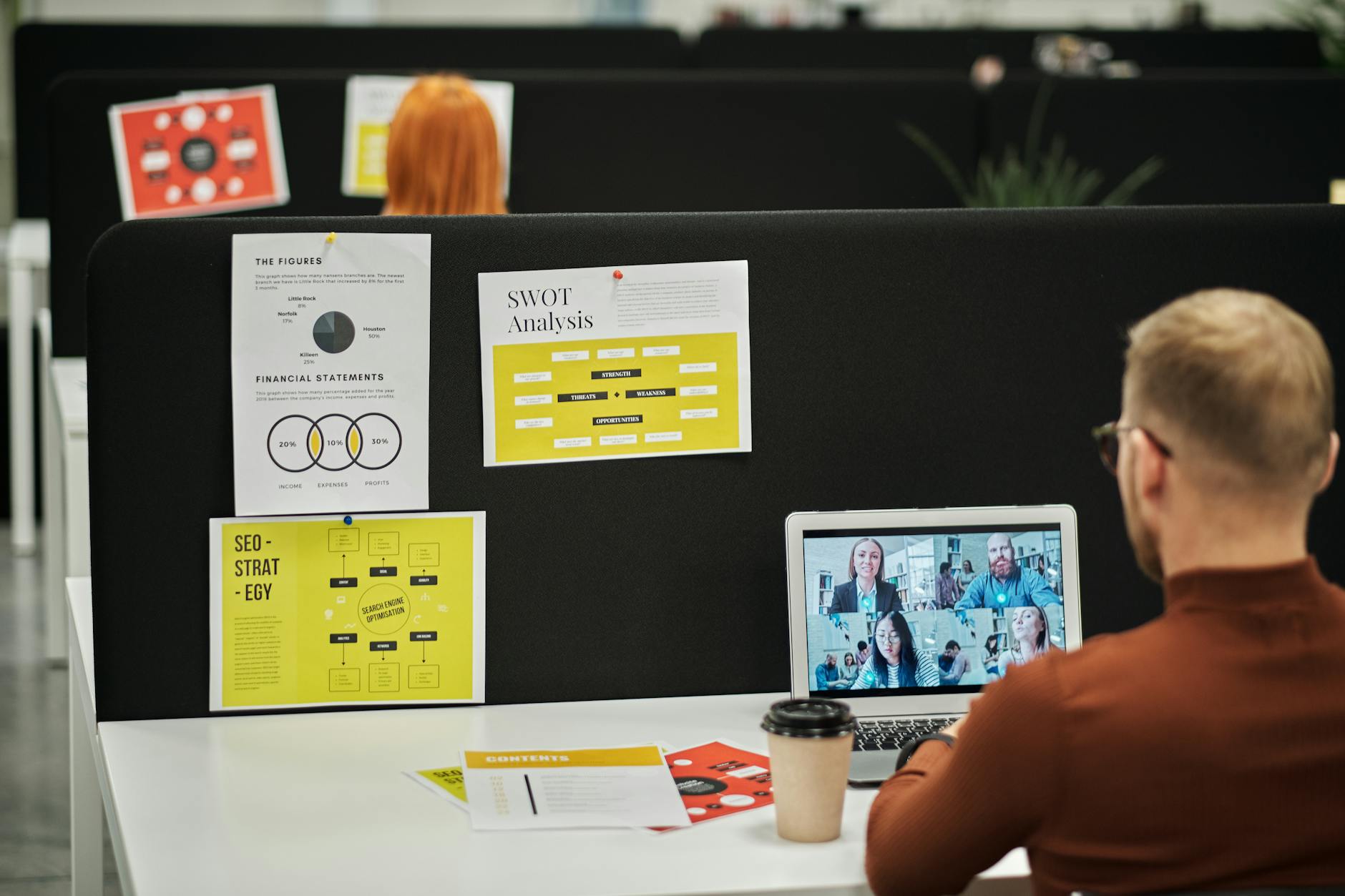 man sitting at desk with laptop in the office