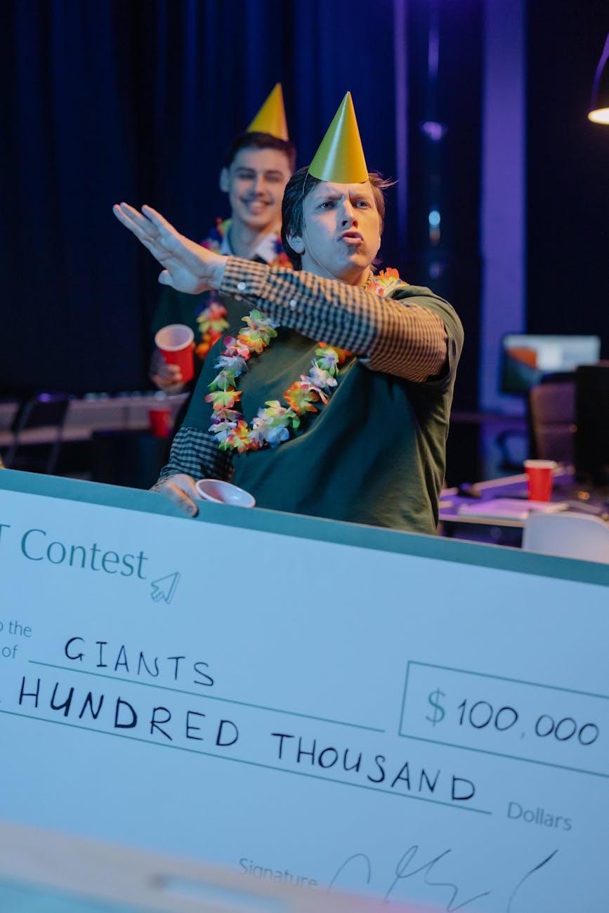 men in party hats celebrating victory in a contest What To Do When Inheriting A Large Sum Of Money