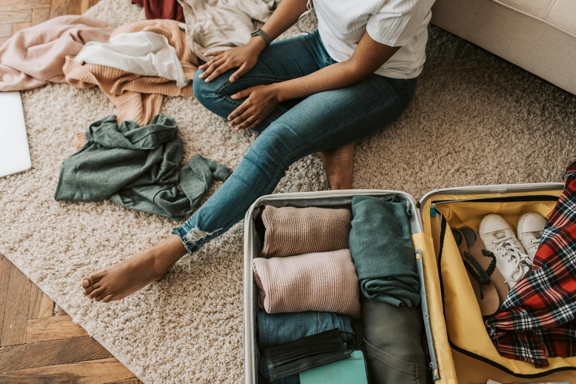 Road Trip Packing: What Every Woman Should Bring for Comfort + Safety 7 a woman packing her suitcase Road Trip Packing: What Every Woman Should Bring for Comfort + Safety