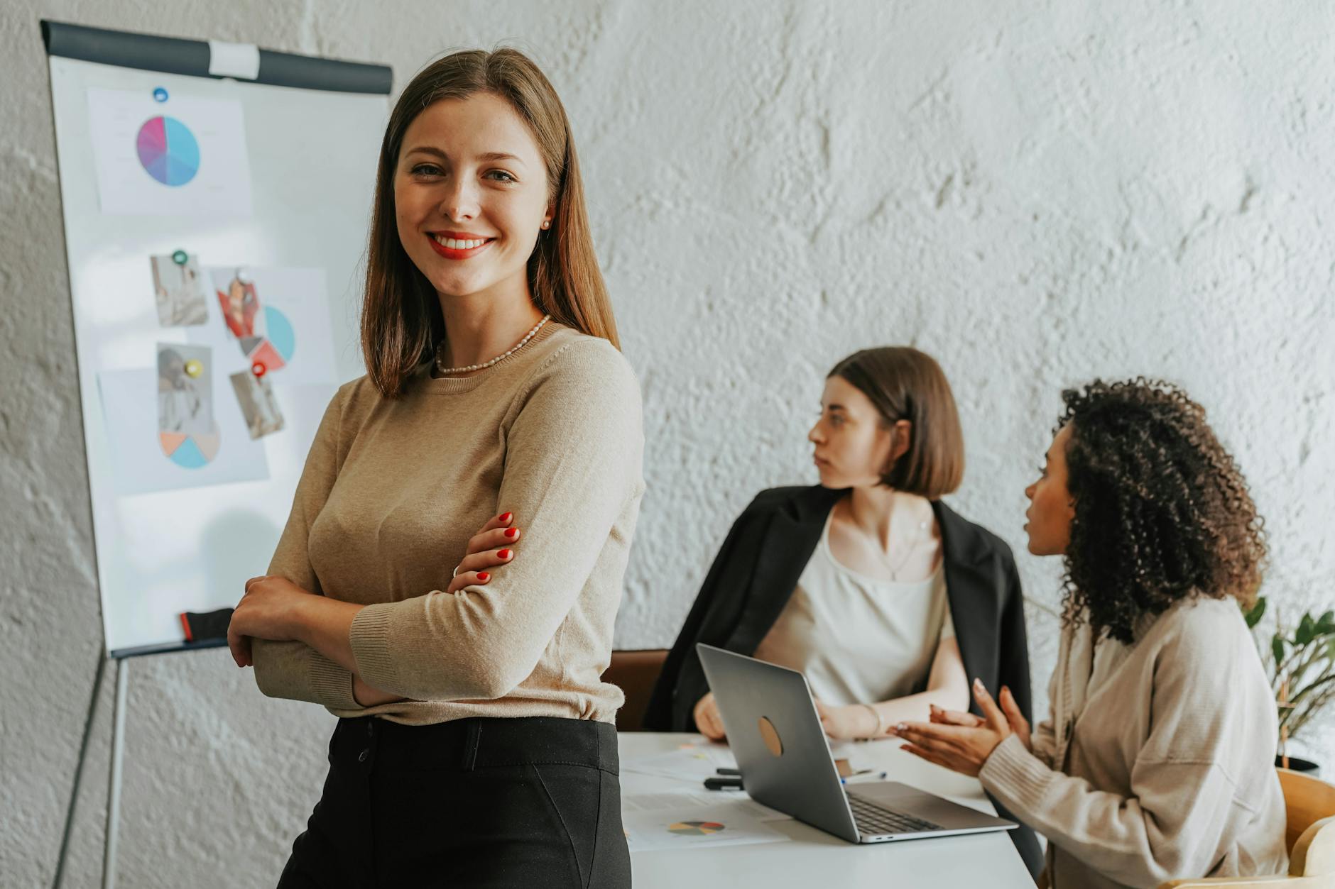 a woman in brown long sleeve shirt standing beside a desk The Business Hacks Every Entrepreneur Overlooks