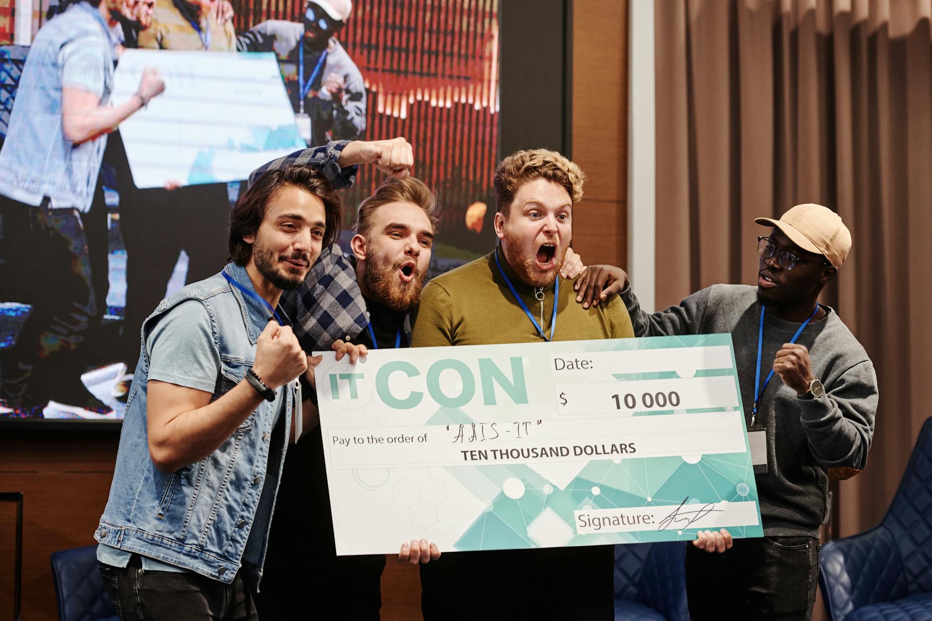 men smiling at the camera