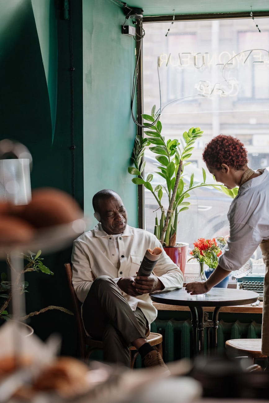 elderly man sitting at the table 7 Practical Tips to Run and Grow Your Business Long-Term