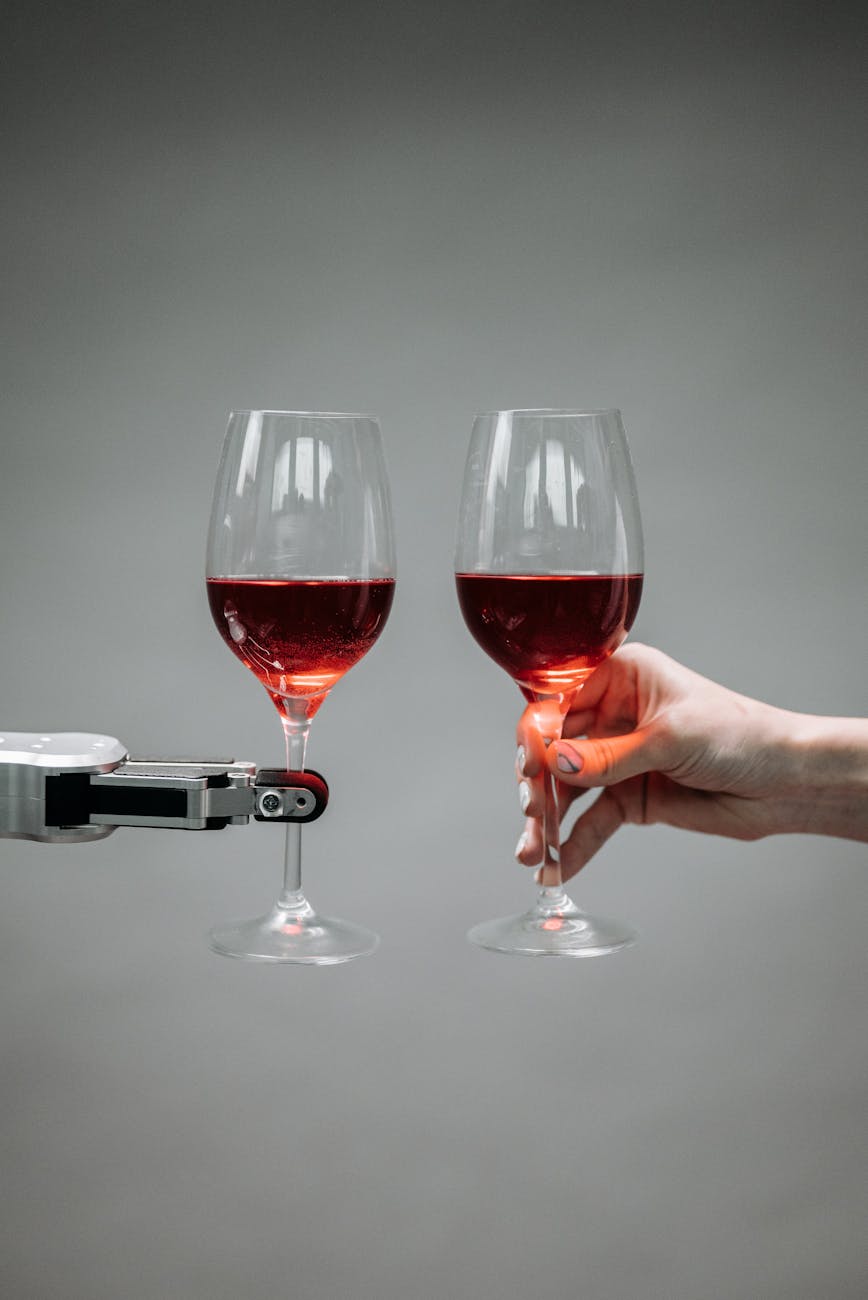 a robot holding a wine The Business Hacks Every Entrepreneur Overlooks