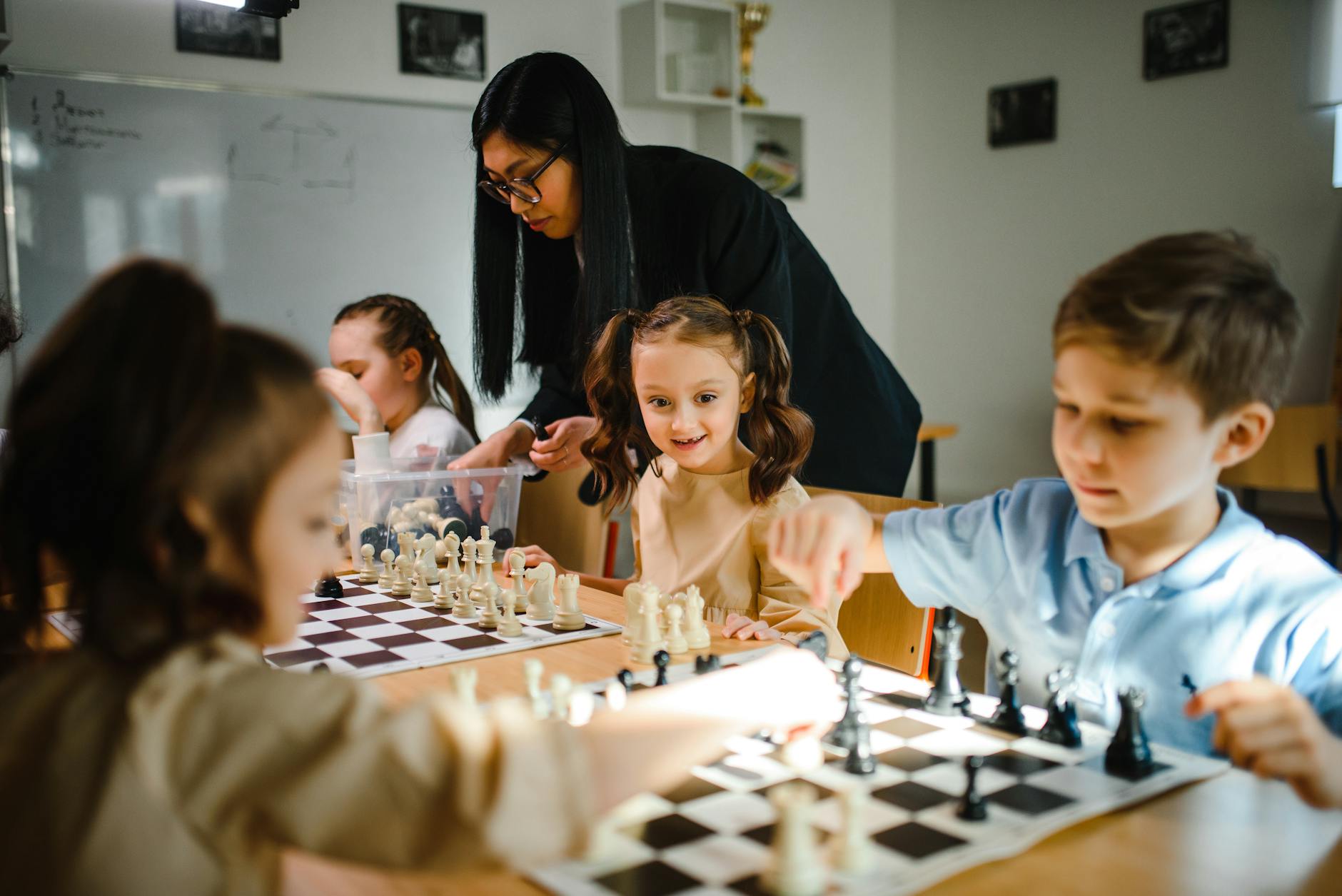 kids playing chess 12 Essential Life Skills to Teach Your Kids (Beyond School Lessons)