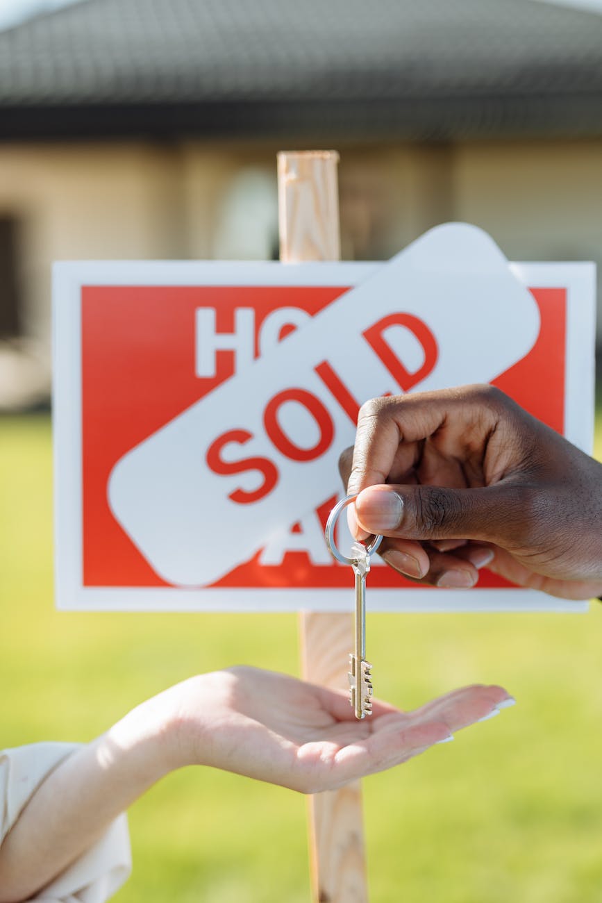 close up photo of a hands and a key Cash Offers Explained: Are iBuyers and Investors Right for You?