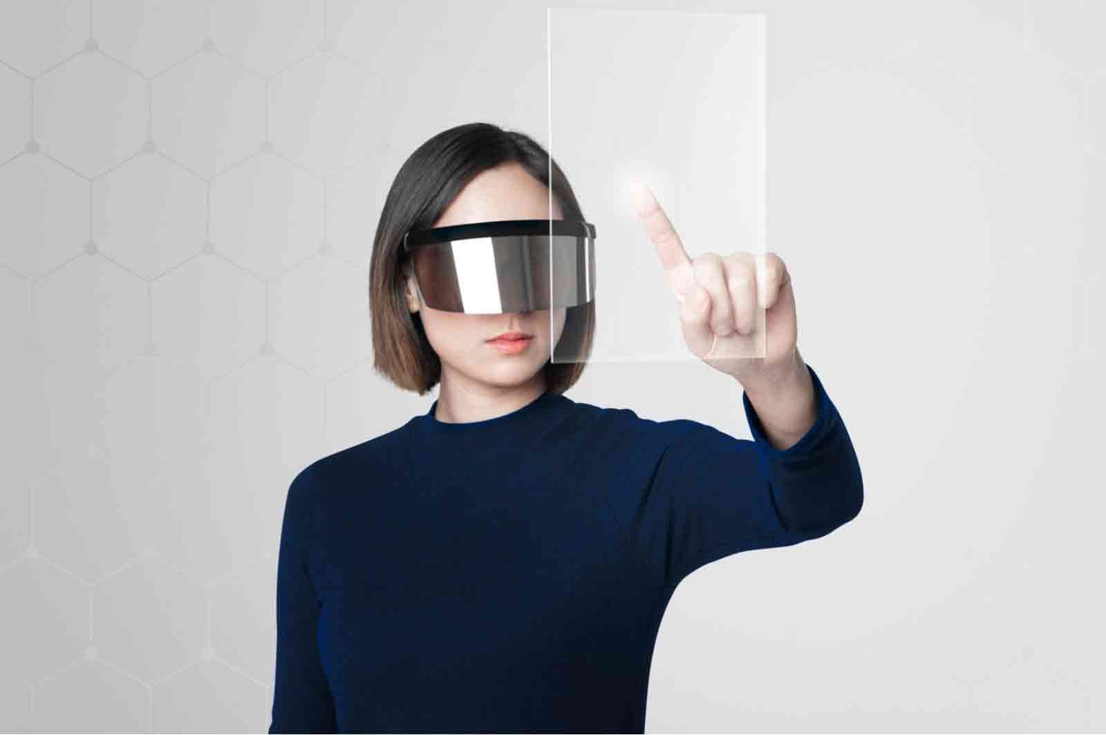 Person wearing augmented reality glasses, interacting with a holographic display in a modern setting. The Rise of Practical Smart Gear for Tactical Tech at Home