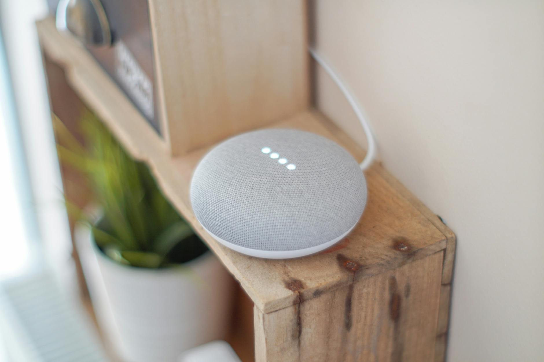 round grey speaker on brown board The Rise of Practical Smart Gear for Tactical Tech at Home
