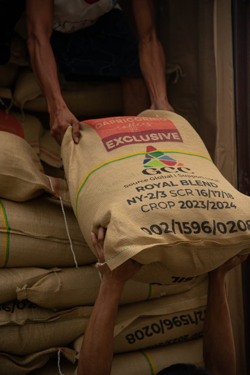 men loading sacks with coffee beans 9 Tips to Plan Ahead for the Next Farming Season