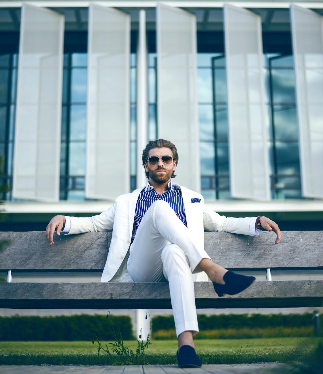 man wearing white suit jacket and white pants How to Protect Your Luxury Assets from Life’s Little Surprises