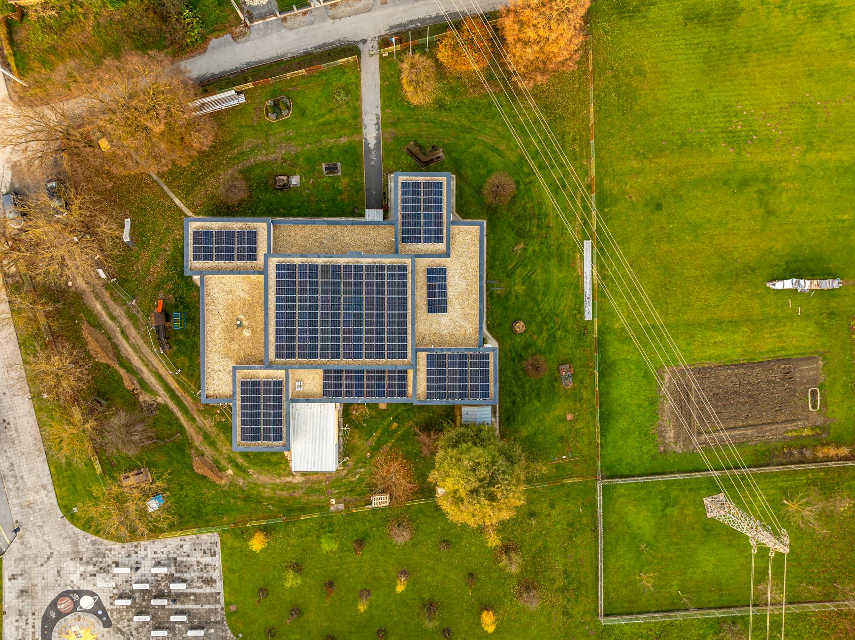 aerial view of solar panels on building in croatia Rural Tech Tools That Make Country Living Easier