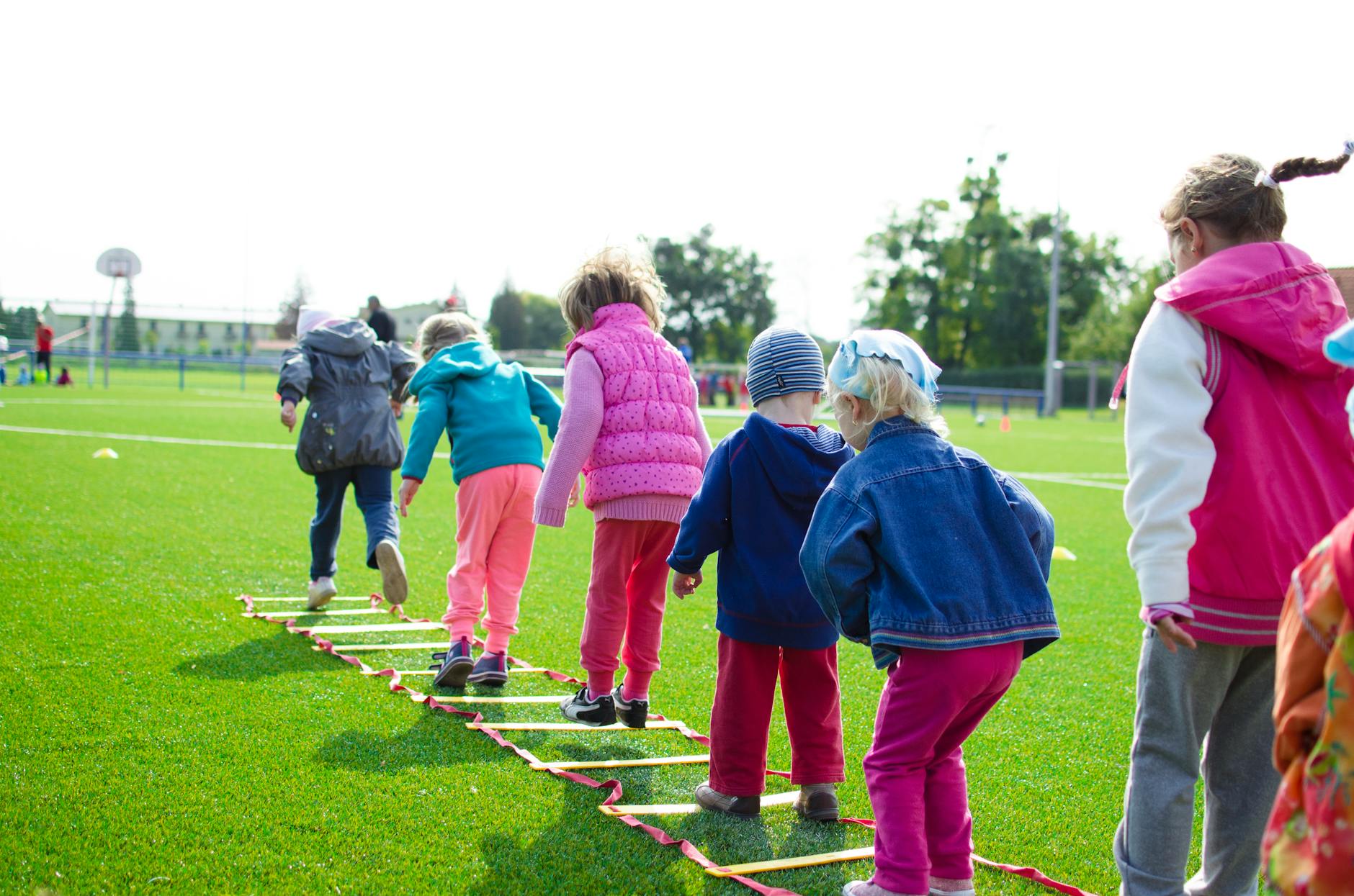 children s team building on green grassland What to Do When Your Child Is Struggling to Make Friends at School