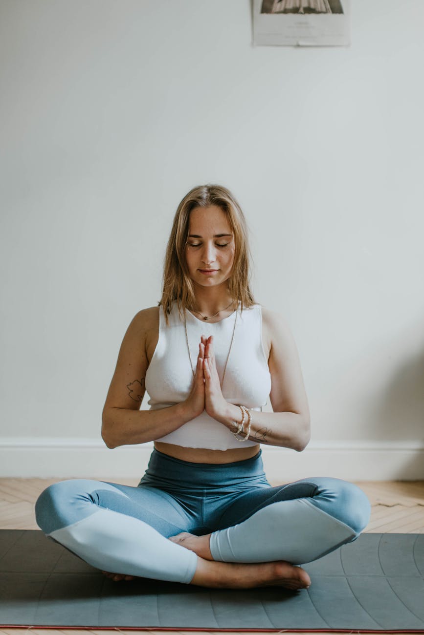 7 Proven Calming Techniques for Your Racing Mind 8 woman doing yoga inside a room Calming Techniques for When Your Thoughts Feel Out of Control