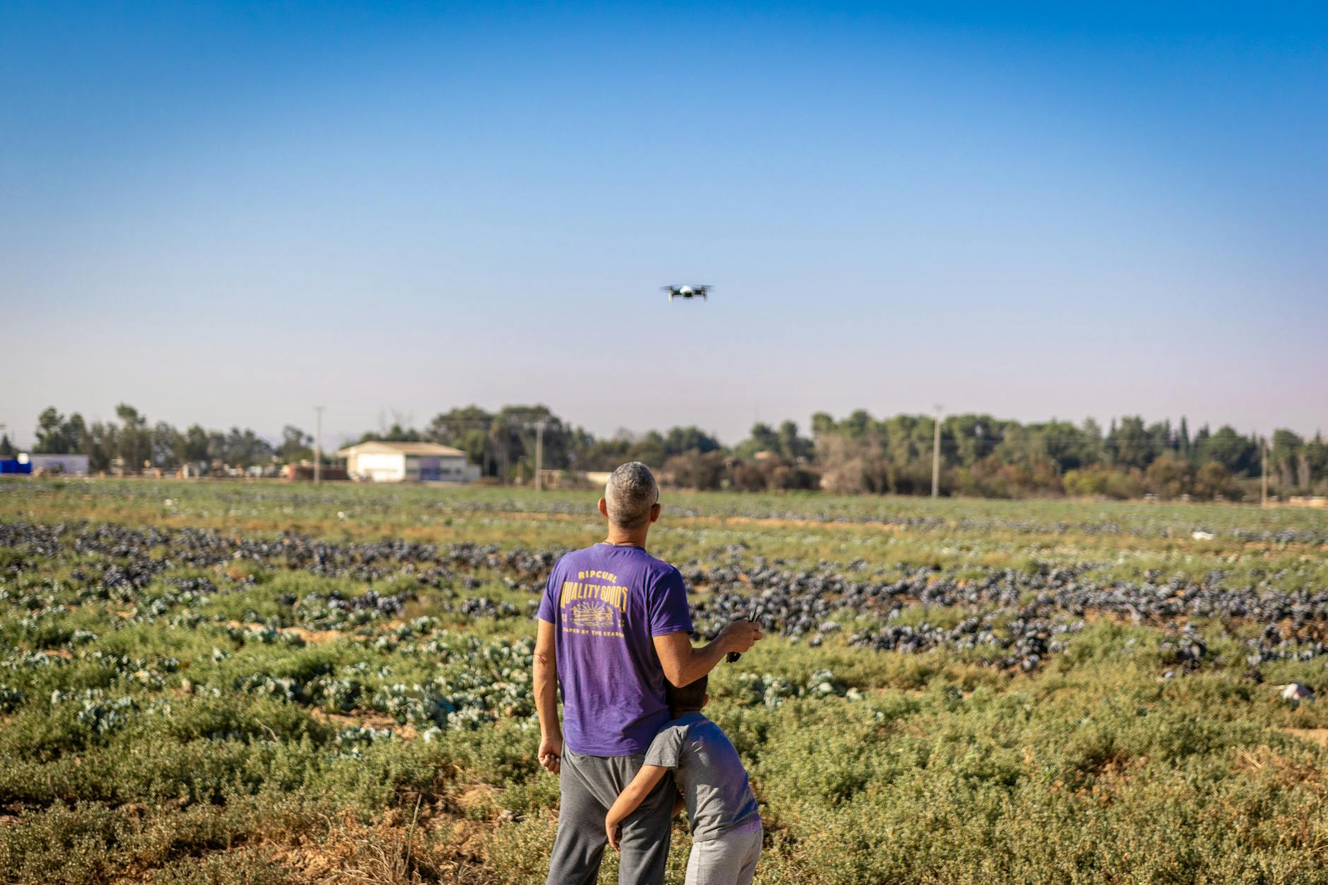man wearing purple shirt standing on grass field 9 Tips to Plan Ahead for the Next Farming Season