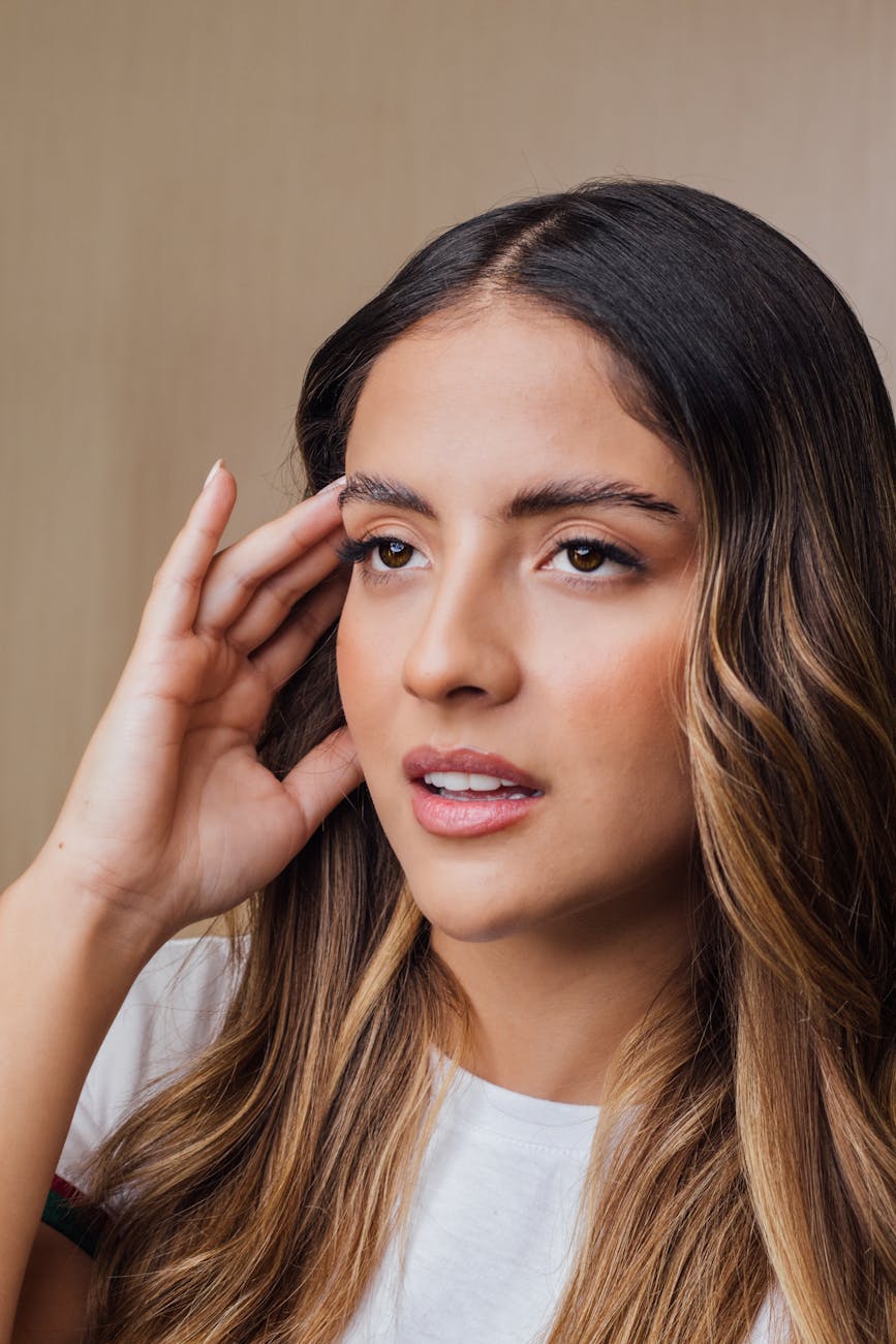 contemplative young woman with long hair Living With Tinnitus: How to Cope With Ringing in the Ears