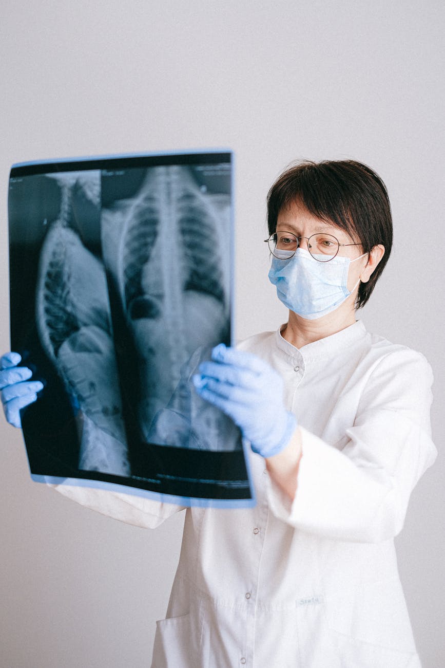 photo of doctor holding x ray result Self-Diagnosis Dos and Don’ts: How to Use the Internet to Your Advantage