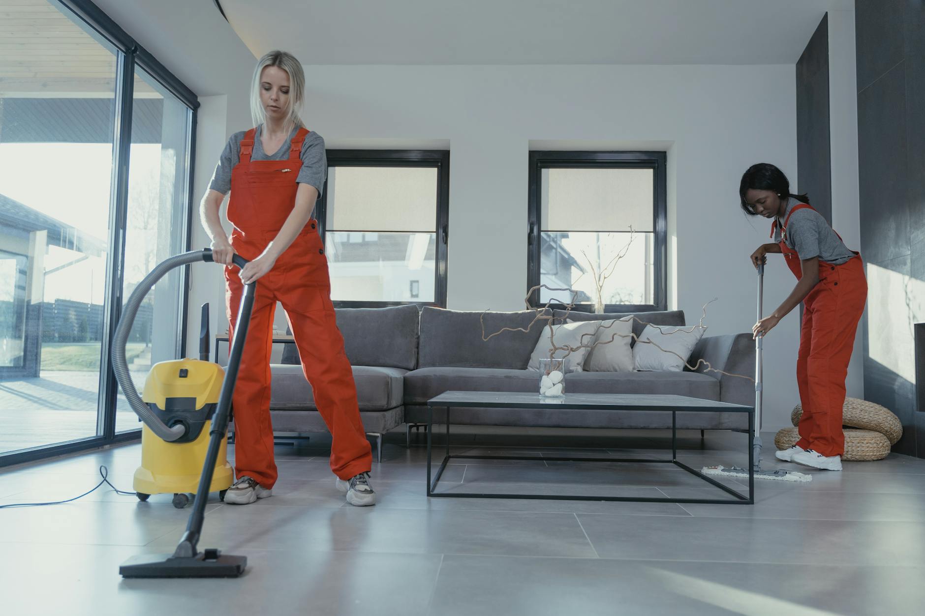 8 Things You’ll Regret Not Doing Before Moving Into Your New Home 11 women in orange uniform cleaning the floor 8 Things You’ll Regret Not Doing Before Moving Into Your New Home