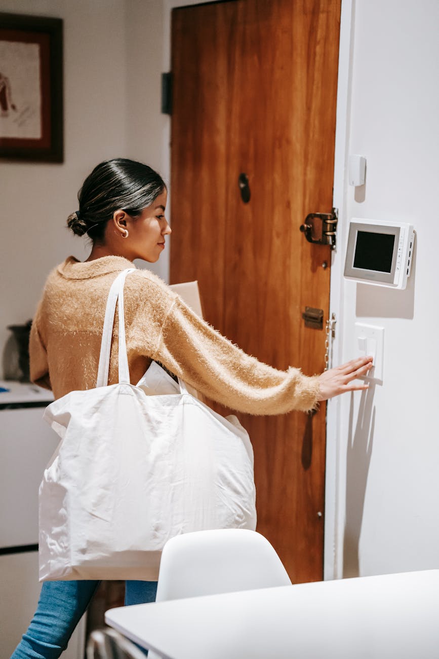 8 Things You’ll Regret Not Doing Before Moving Into Your New Home 12 woman with bag going out for delivering 8 Things You’ll Regret Not Doing Before Moving Into Your New Home