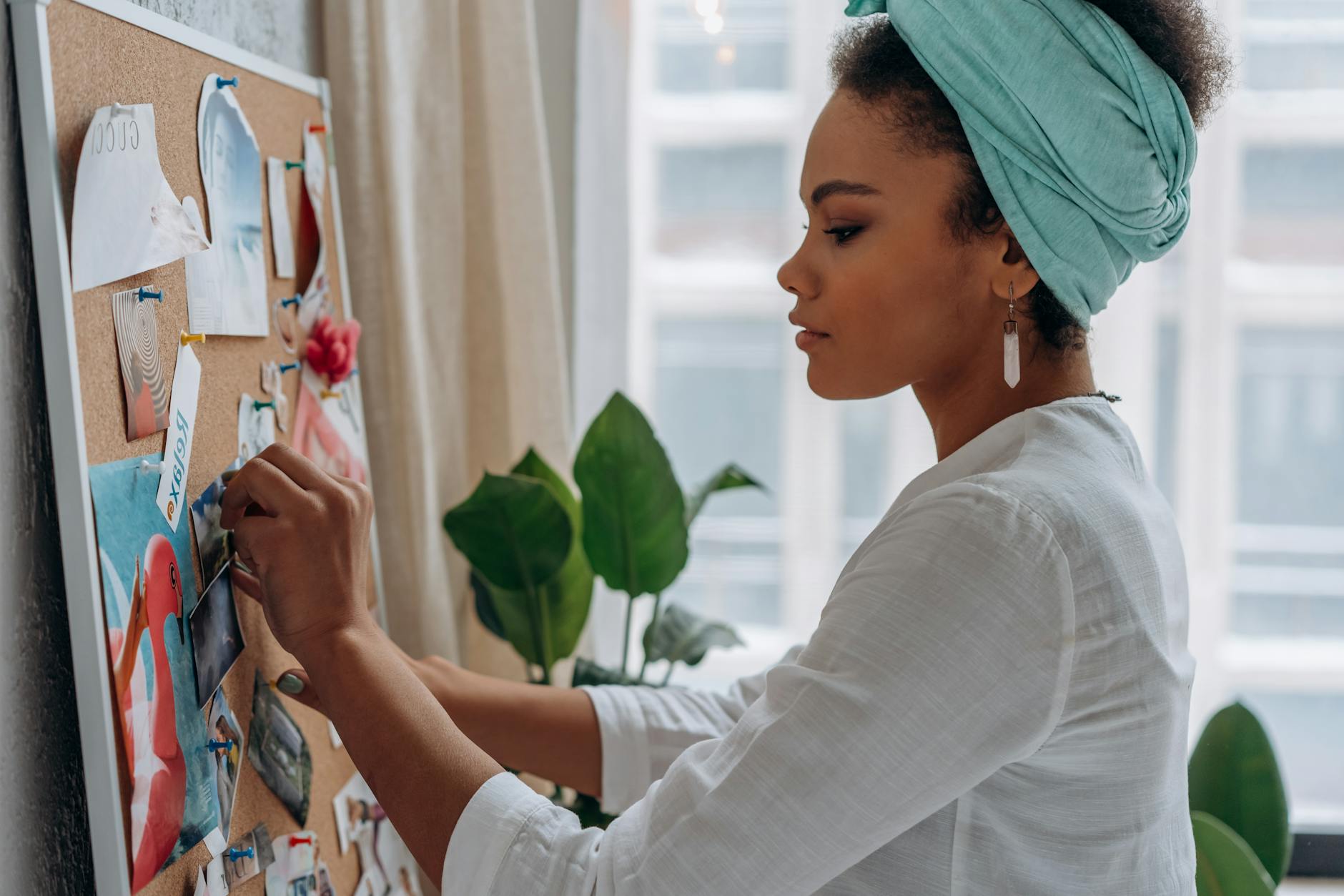 woman in white long sleeve shirt holding pink and white floral textile The Hidden Struggle of High-Achieving Women: Mental Burnout