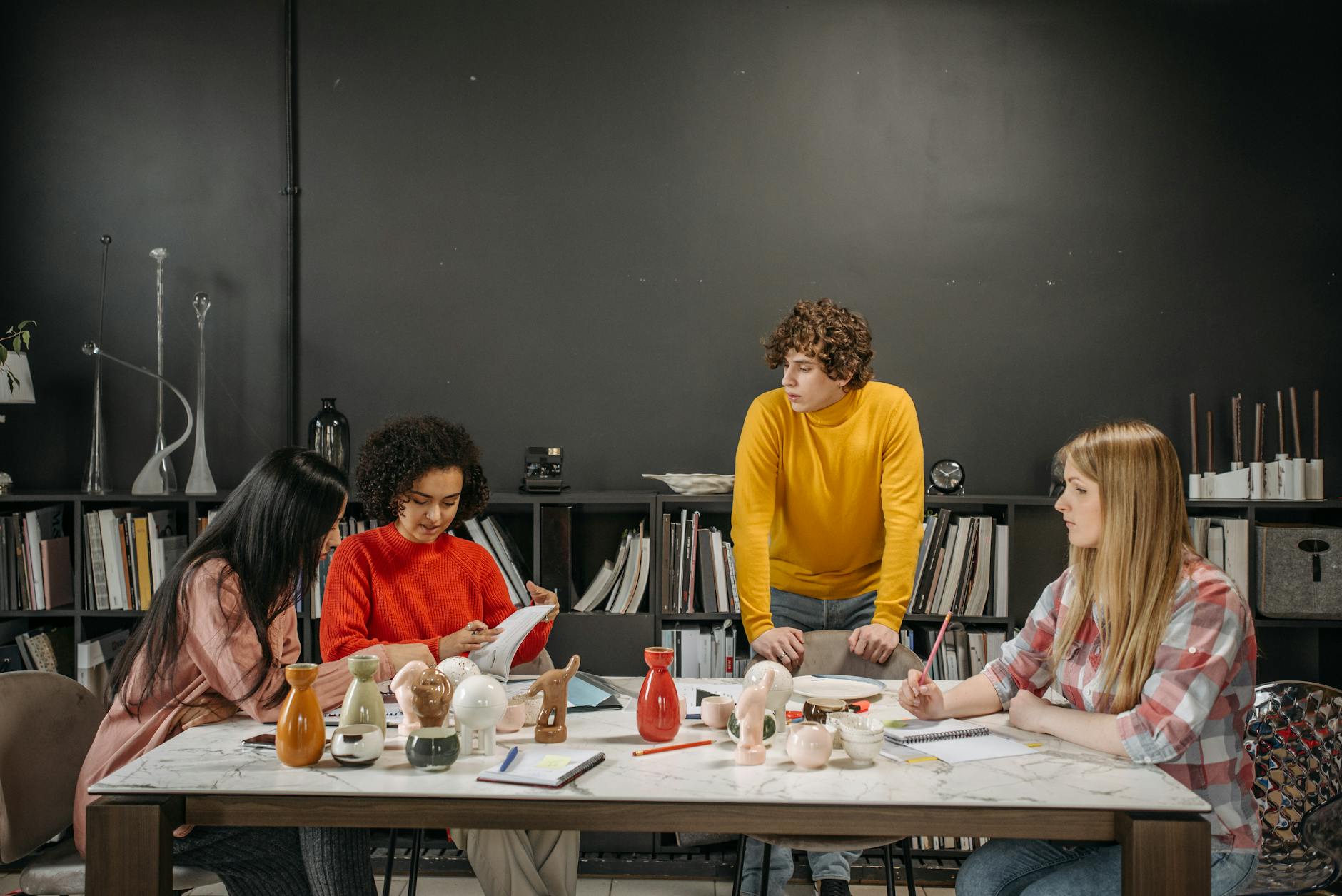 What Goes Into Product Design? 6 Key Steps to Create a Successful Product 9 young businesspeople having a business meeting What Goes Into Product Design? 6 Key Steps to Create a Successful Product