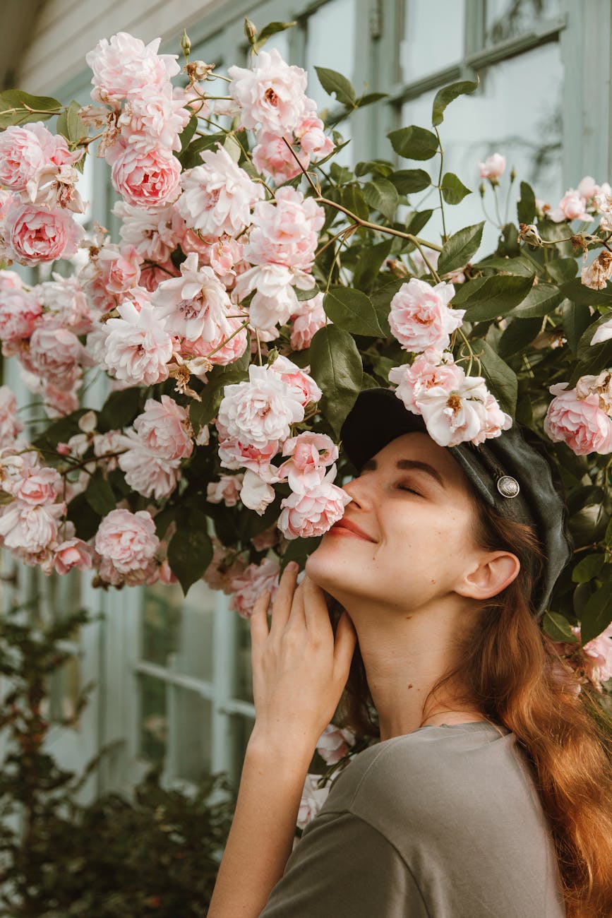 beautiful woman near pink flowers Rediscover Yourself: 10 Gentle Ways to Reconnect with Who You Are