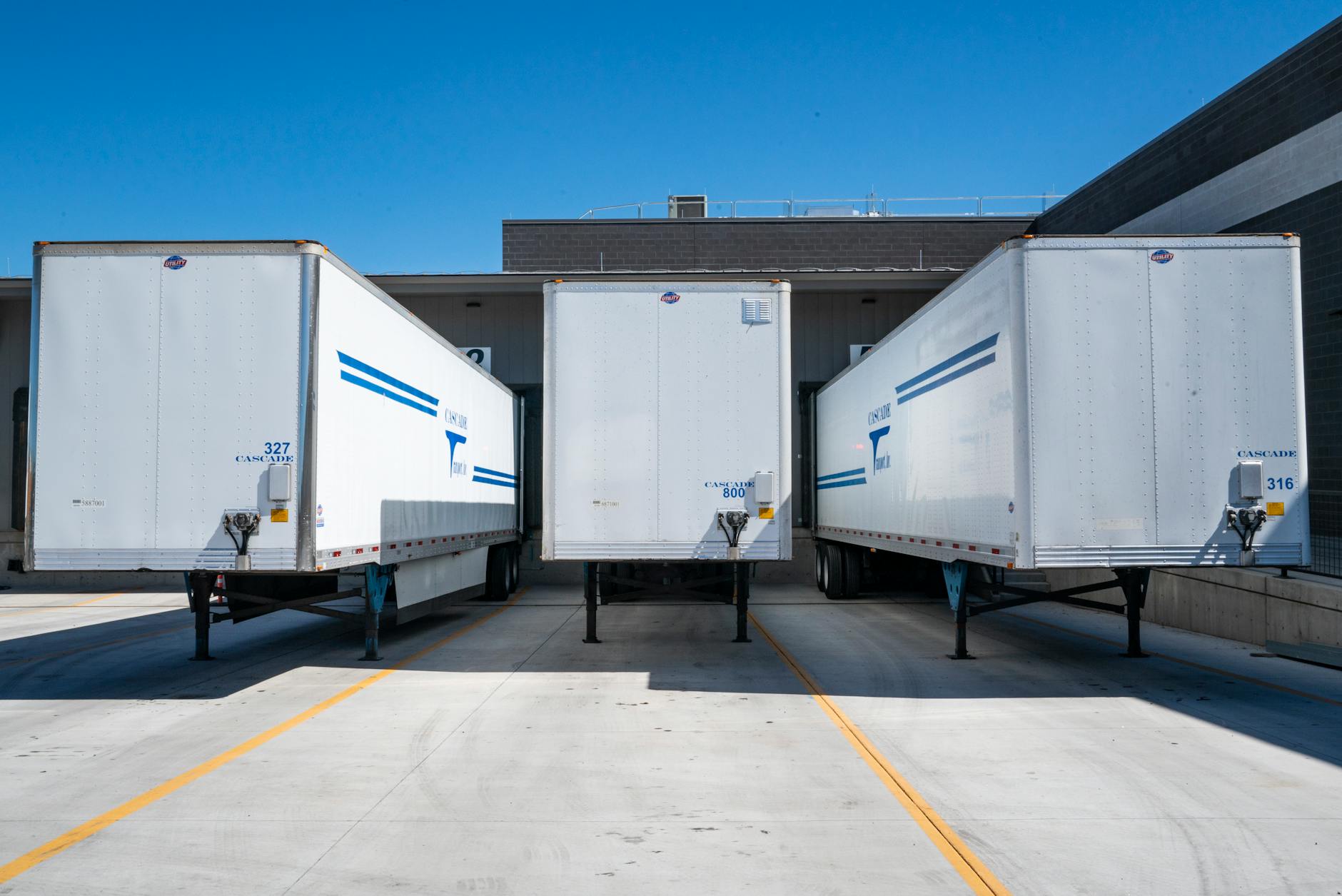 three white enclosed trailers Tips For Mastering Your Supply Chain In The Digital Age