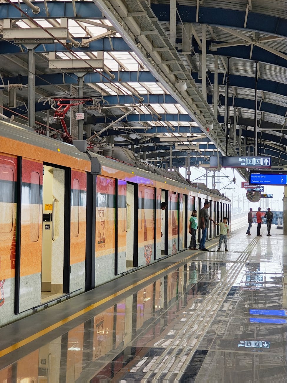 colorful train at modern station with passengers Sustainability Mindset: 7 Ethical Ways to Cut Carbon on Your Commute