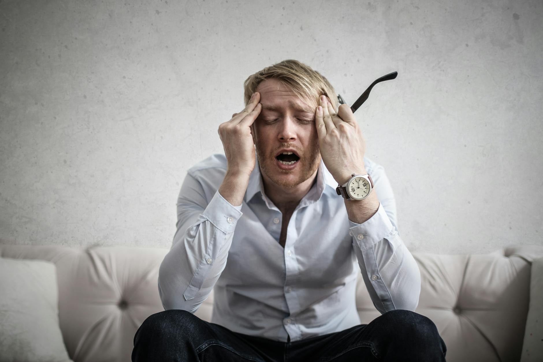 photo of man touching his head Why Successful Businesses Break Down Plus 6 Ways to Prevent It