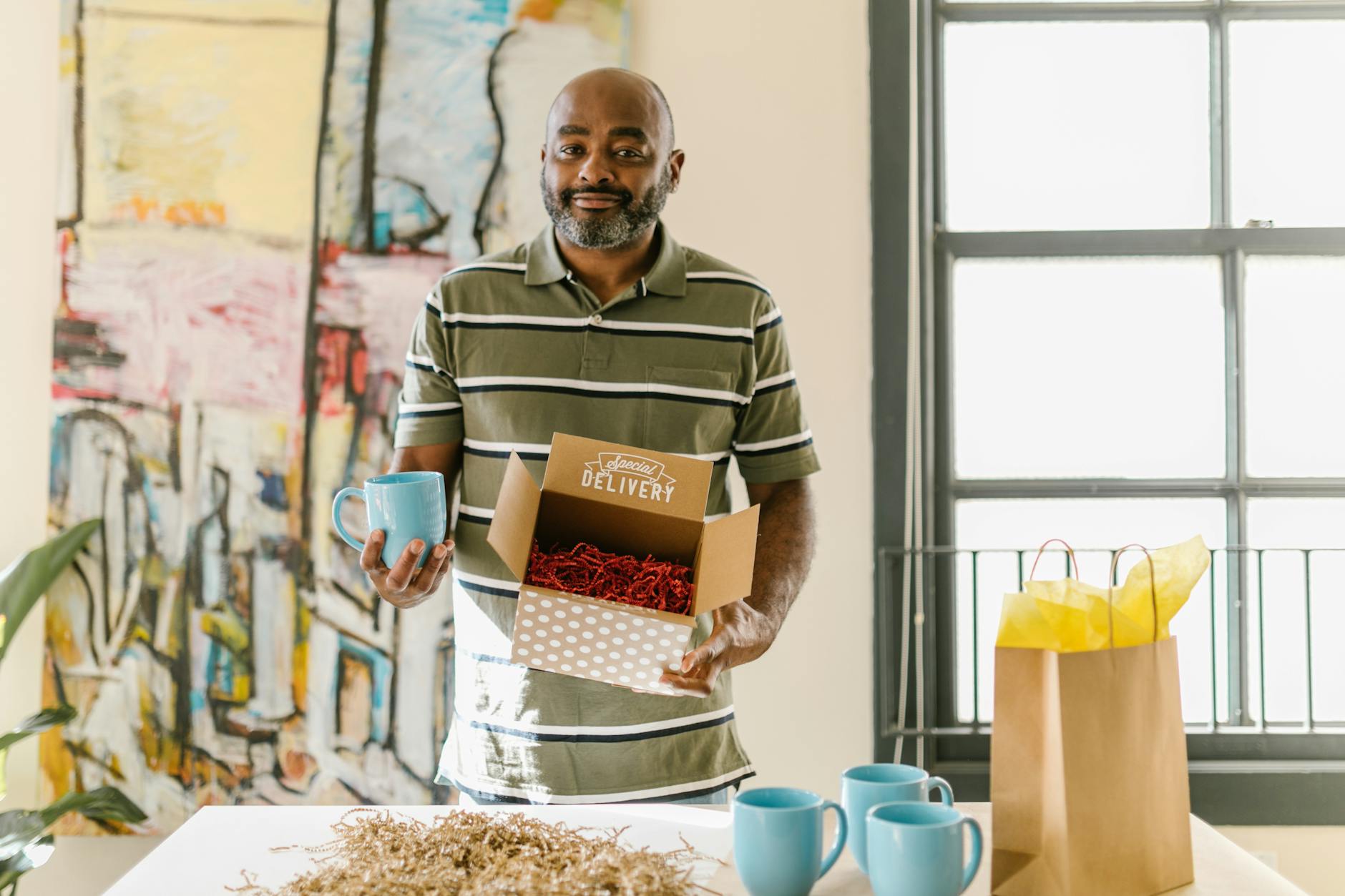 a man packing cups for delivery The Sanity-Saving Guide for Online Store Owners