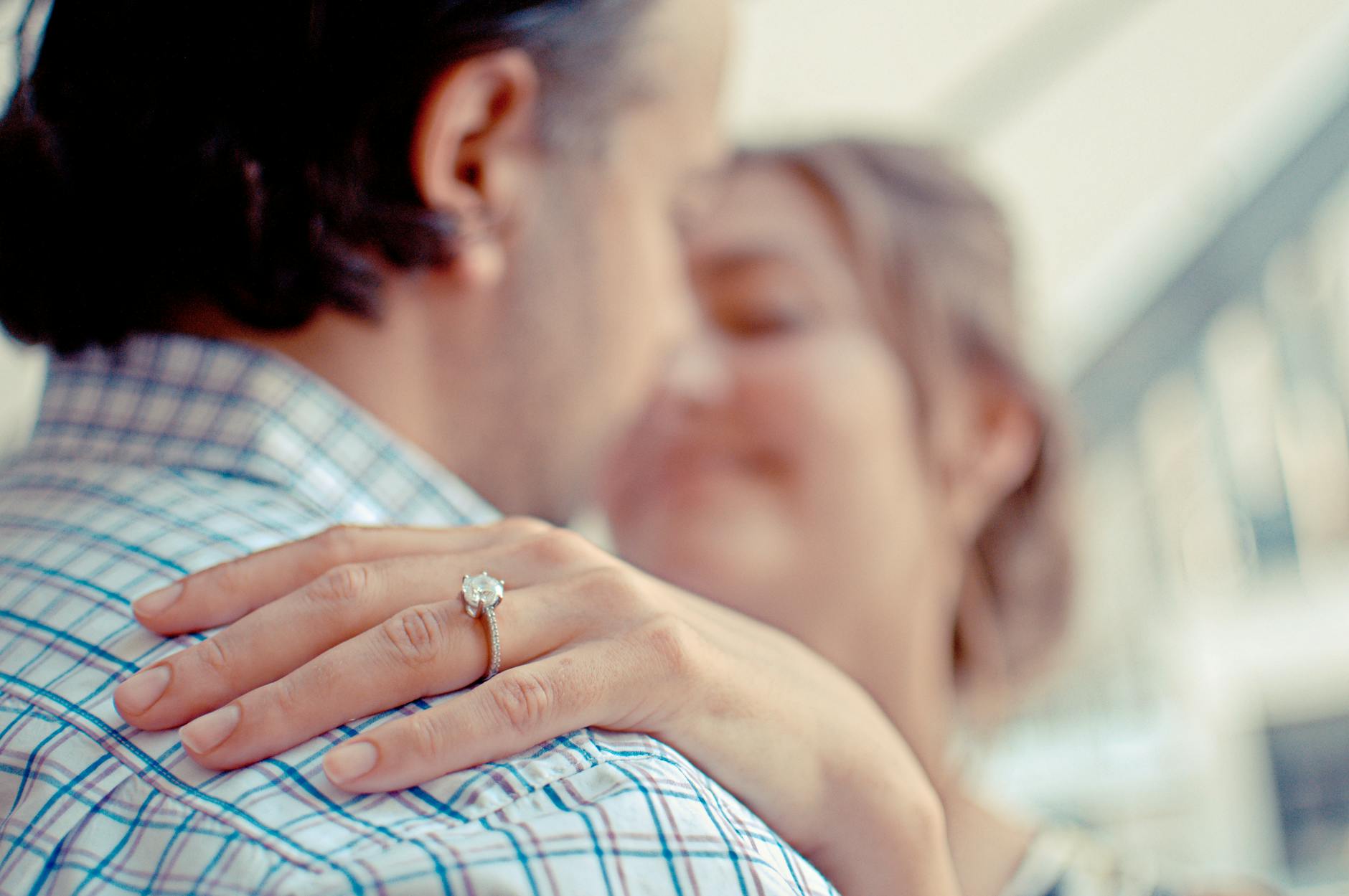 shallow focus photo of man and woman kissing Best Stores Where You Can Buy Gold Engagement Rings