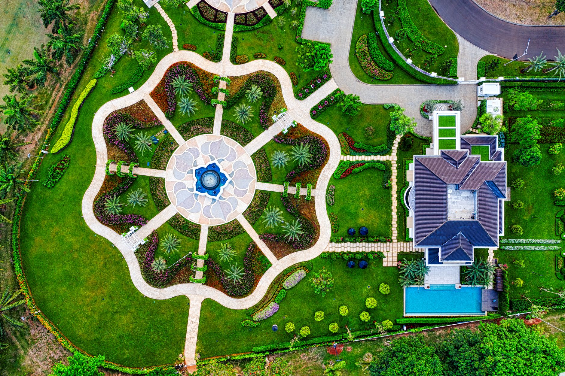 aerial view of garden near the house surrounded with trees Smart Plant Sourcing for Landscaping Projects